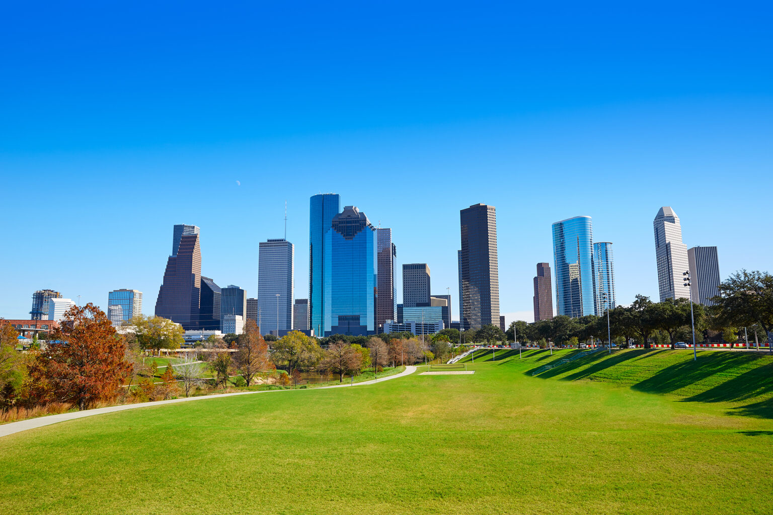 Houston,Skyline,In,Sunny,Day,From,Park,Grass,Of,Texas InterAmerica